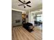 Open living room featuring hardwood floors, fireplace, and view into the dining area and kitchen at 77 Peachtree Ne Pl # 211, Atlanta, GA 30309