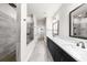 Beautiful bathroom featuring a double sink vanity, an expansive walk-in shower, and neutral-toned tile at 219 Phillips Ln, Alpharetta, GA 30009
