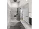 Walk-in shower features rain shower head, tiled walls, and bench seating at 219 Phillips Ln, Alpharetta, GA 30009