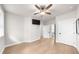 Bright bedroom offers ceiling fan, tv, and hardwood flooring at 219 Phillips Ln, Alpharetta, GA 30009