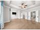 Bedroom featuring hardwood floors, a ceiling fan, and staircase access at 219 Phillips Ln, Alpharetta, GA 30009