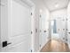 Hallway with hardwood floors leads to bedrooms and bathrooms at 219 Phillips Ln, Alpharetta, GA 30009