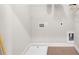 Clean laundry room features tile floors and in-unit connections at 219 Phillips Ln, Alpharetta, GA 30009
