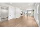 Spacious living room with a fireplace, built-in shelving, and expansive windows, all bathed in natural light at 219 Phillips Ln, Alpharetta, GA 30009