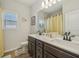 Bathroom with a double sink vanity and modern fixtures, designed for convenience and functionality at 35 Henson Farm Dr, Loganville, GA 30052