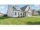 Beautiful home showcasing a meticulously maintained lawn, complemented by a two-car garage and stylish curb appeal at 35 Henson Farm Dr, Loganville, GA 30052