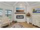 Inviting fireplace adorned with a wooden mantle and a wall-mounted television at 35 Henson Farm Dr, Loganville, GA 30052