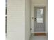 Close-up of a front door and brick wall with a welcome mat at 35 Henson Farm Dr, Loganville, GA 30052