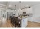 Bright kitchen featuring stainless steel appliances, granite countertops, and a large island with seating at 35 Henson Farm Dr, Loganville, GA 30052