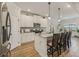 Stylish kitchen featuring an island with bar seating, granite countertops, and stainless steel appliances at 35 Henson Farm Dr, Loganville, GA 30052