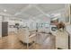 Spacious living room with hardwood floors, fireplace, and an open-concept design connecting to the kitchen at 35 Henson Farm Dr, Loganville, GA 30052