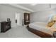 Large main bedroom with a cozy electric fireplace and an expansive view of the space at 35 Henson Farm Dr, Loganville, GA 30052
