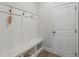 Mudroom with built-in bench seating and hooks, perfect for organizing coats and shoes at 35 Henson Farm Dr, Loganville, GA 30052