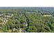 Aerial view of the house showcasing the surrounding trees at 5195 Overbend Trl, Suwanee, GA 30024