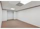 Empty basement with neutral carpet, paneled walls, and closet space, awaiting personalization at 5195 Overbend Trl, Suwanee, GA 30024