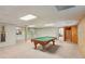Bright basement rec room with billiard table, and plenty of room for customization at 5195 Overbend Trl, Suwanee, GA 30024