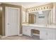 Elegant bathroom featuring double sinks, white cabinets, a large mirror, and tile flooring at 5195 Overbend Trl, Suwanee, GA 30024