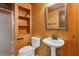 Rustic bathroom with wood paneling, a stand-up shower, and built-in shelving for storage at 5195 Overbend Trl, Suwanee, GA 30024