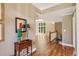 Bright open floor plan with hardwood floors and an elegant staircase leading to the upper level at 5195 Overbend Trl, Suwanee, GA 30024