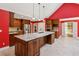 Gourmet kitchen with stainless steel appliances, granite counters, and a center island at 5195 Overbend Trl, Suwanee, GA 30024