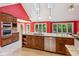 Well-appointed kitchen with a large island, modern appliances, and access to backyard at 5195 Overbend Trl, Suwanee, GA 30024