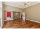 Spacious living area featuring hardwood floors, high ceilings, and an open floor plan to the upper level at 5195 Overbend Trl, Suwanee, GA 30024