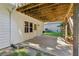 Back patio with wooden support beams and concrete under deck creates the perfect place to relax at 5195 Overbend Trl, Suwanee, GA 30024