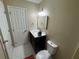 Bathroom features single vanity with white marble top and walk-in closet at 110 Stagecoach Trl, Stockbridge, GA 30281