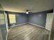 Spacious bedroom featuring vinyl flooring, ceiling fan and a window at 110 Stagecoach Trl, Stockbridge, GA 30281