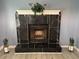 Close-up of elegant black marble fireplace with white trim at 110 Stagecoach Trl, Stockbridge, GA 30281