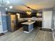Updated kitchen with stainless steel appliances and center island at 110 Stagecoach Trl, Stockbridge, GA 30281