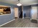 Open-concept living room with view of the stairs and kitchen at 110 Stagecoach Trl, Stockbridge, GA 30281