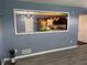 Living room view shows updated kitchen with stainless steel appliances at 110 Stagecoach Trl, Stockbridge, GA 30281