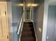Carpeted stairs lead upwards with blue-grey painted walls at 110 Stagecoach Trl, Stockbridge, GA 30281