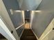 View of stairway with carpeted treads leading to a lower level at 110 Stagecoach Trl, Stockbridge, GA 30281