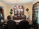 Formal dining room with elegant furniture, a stylish chandelier, and decorative accents, perfect for hosting gatherings at 3140 Ridge Hill Pkwy, Douglasville, GA 30135