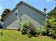 Side view of a home featuring vinyl siding, a well-maintained yard, and mature landscaping, creating a private outdoor space at 3140 Ridge Hill Pkwy, Douglasville, GA 30135