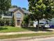 Charming two-story home with a brick facade, mature trees and well-manicured landscaping, offering great curb appeal at 3140 Ridge Hill Pkwy, Douglasville, GA 30135