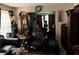 Elegant living room featuring classic furniture, detailed decor, and a glimpse into the adjacent dining area at 3140 Ridge Hill Pkwy, Douglasville, GA 30135