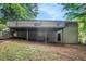 Spacious backyard featuring wooden deck, level ground, and mature trees at 4442 Cedar Ridge Trl, Stone Mountain, GA 30083