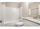 Clean bathroom with white tile, shower-tub combo, and granite vanity at 4442 Cedar Ridge Trl, Stone Mountain, GA 30083