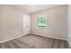 Neutral bedroom featuring new carpet, closet, and natural light from the window at 4442 Cedar Ridge Trl, Stone Mountain, GA 30083