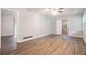 Spacious bedroom featuring wood-look floors, ceiling fan and neutral paint at 4442 Cedar Ridge Trl, Stone Mountain, GA 30083