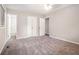 Large bedroom with plush carpeting and access to ensuite bathroom and closet at 4442 Cedar Ridge Trl, Stone Mountain, GA 30083