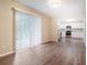 Open-concept living space featuring access to a kitchen with stainless steel appliances and white cabinets at 4442 Cedar Ridge Trl, Stone Mountain, GA 30083