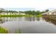 An aerial view of community properties surrounding a pond at 601 Cork St, Woodstock, GA 30188