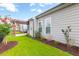 A well-maintained backyard showing the green lawn and plants at 601 Cork St, Woodstock, GA 30188