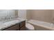 A clean bathroom featuring a tub and shower combination at 601 Cork St, Woodstock, GA 30188