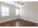 Bedroom showcasing hardwood floors, natural light, and plantation shutters at 601 Cork St, Woodstock, GA 30188