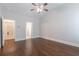 Open bedroom with hardwood floors and access to en suite bathroom and walk-in closet at 601 Cork St, Woodstock, GA 30188